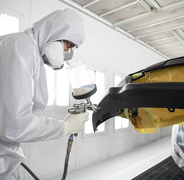 Collision Center Technician Painting a Vehicle | Prince Toyota in Tifton GA